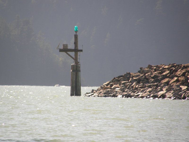 End of the new breakwater
This stupid dolphin/pier with the blue light on it is the friggin thing that ripped my new sail!  A tough slog upwind to get around it.  Cleared it by 4ft with my board, forgot to look up at the overhang.  Snagged the top of my sail and put a 10 inch gash in it.   
